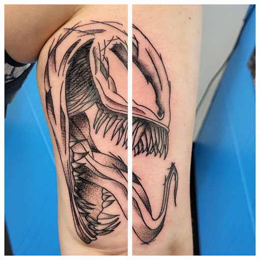 Explore breast cancer ribbon tattoo ideas, creative tattoo ideas in Green Bay, available at Wizard Ink Tattoo Company