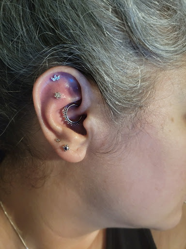 Find inbetween boob tattoo ideas for your next unique tattoo in Vancouver at The Powers That Be Body Piercing