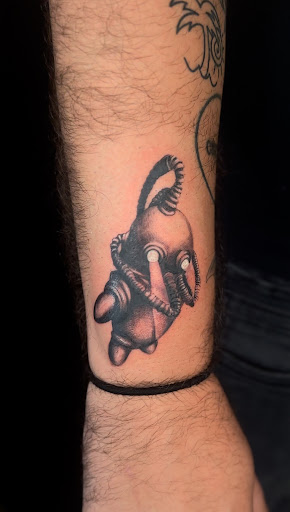 Explore spine tattoo ideas, creative tattoo ideas in Titusville, available at Space Coast Ink Tattoo Studio