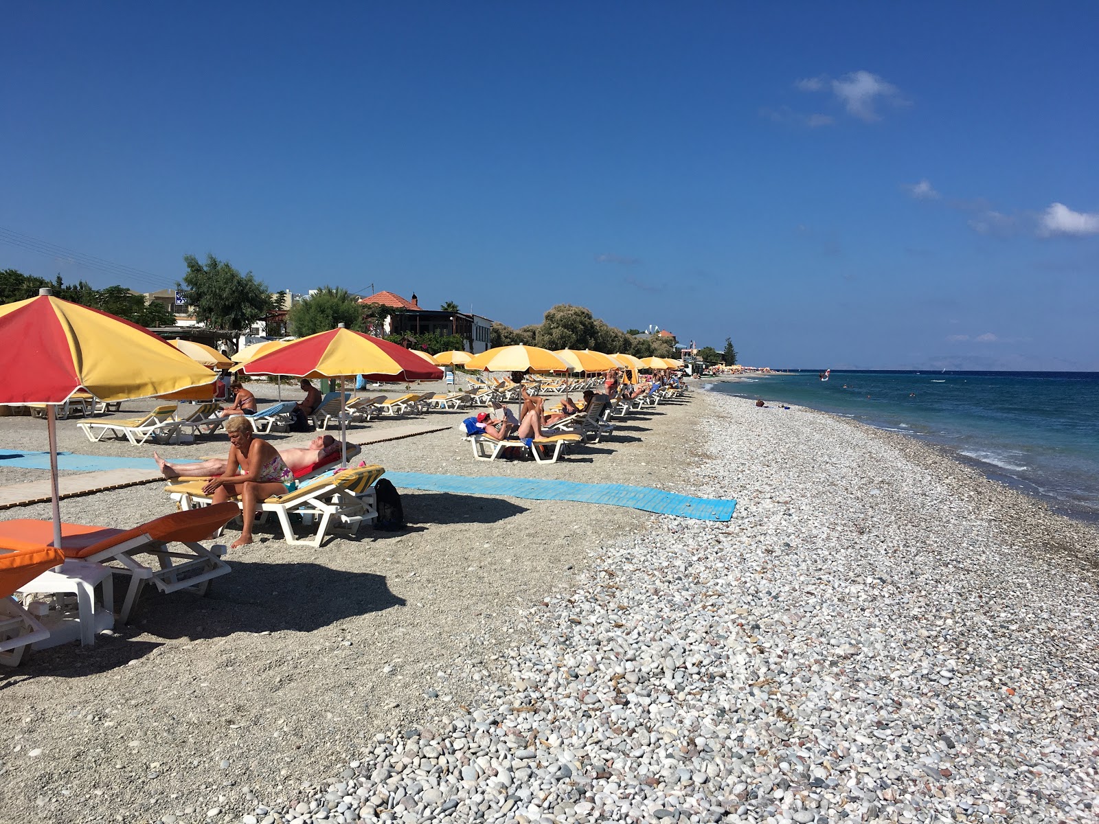Foto van Ialysos beach met beige zand en kiezels oppervlakte