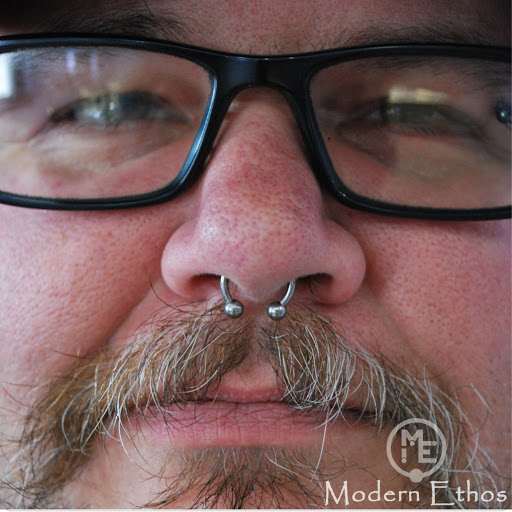 Explore black male tattoo ideas, creative tattoo ideas in New Cumberland, available at Modern Ethos Piercing