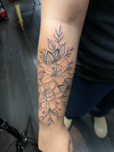 Explore hand tattoo cover up ideas, creative tattoo ideas in Erie, available at Andromeda Studios