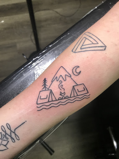 Explore snake tattoo ideas, creative tattoo ideas in Winter Park, available at Black Pine Tattoo