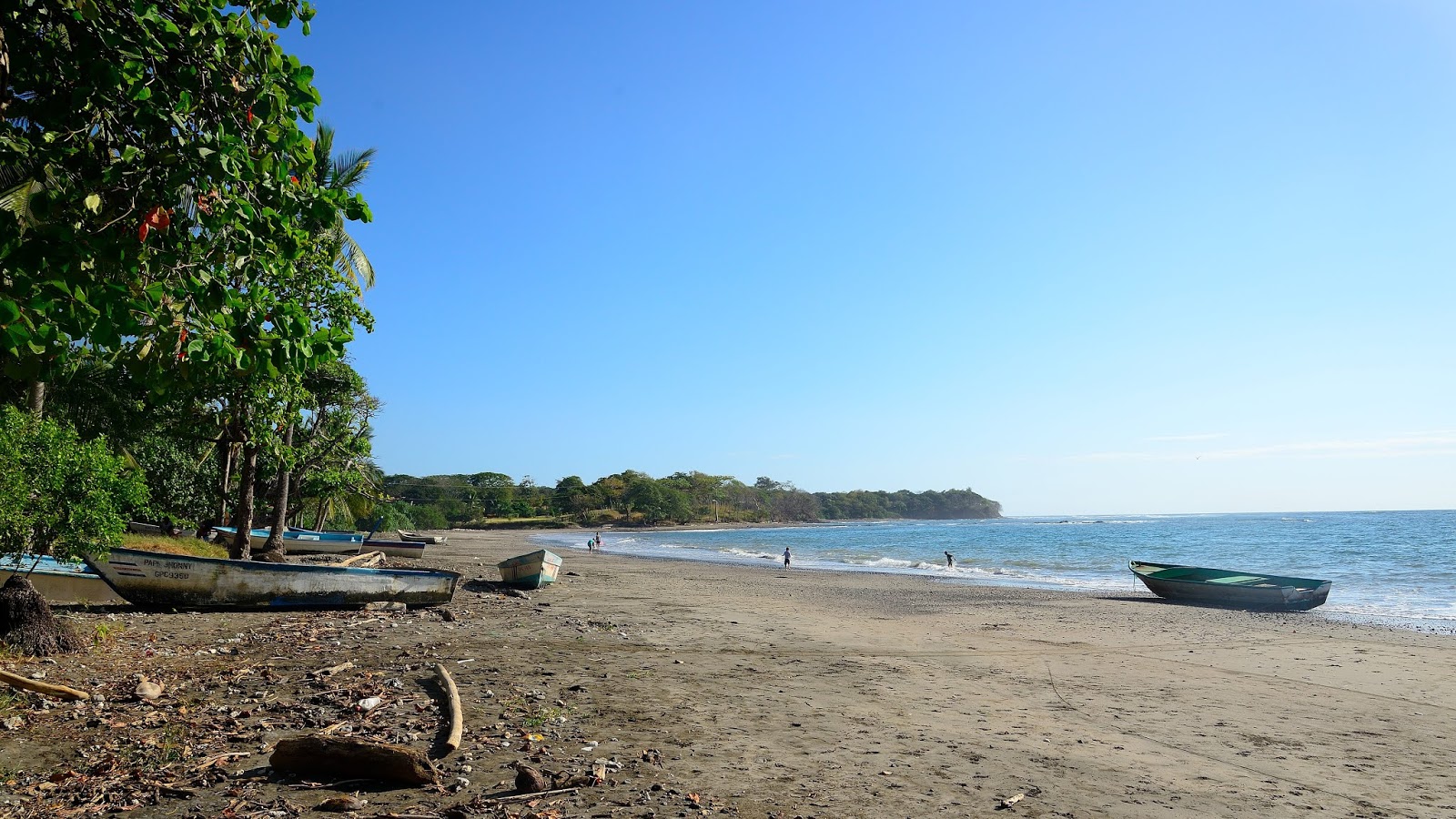 Valokuva Lagarto Beachista. pinnalla harmaa hiekka:n kanssa