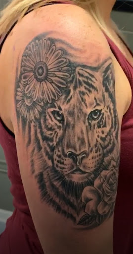 Explore skiing tattoo ideas, creative tattoo ideas in Inman, available at Nine Lives Tattoo