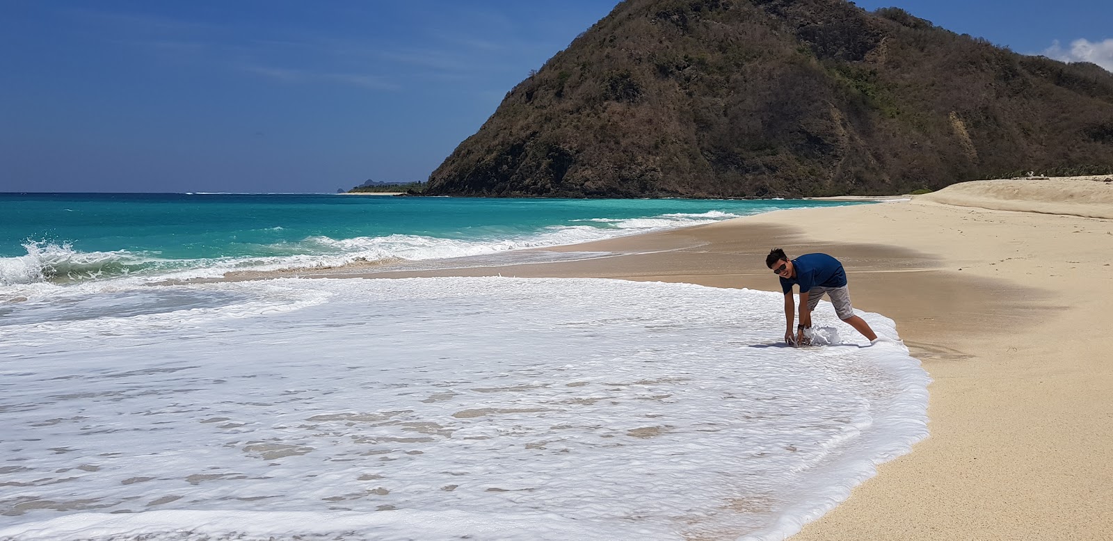 Tomang-Omang Beach'in fotoğrafı doğal alan içinde bulunmaktadır
