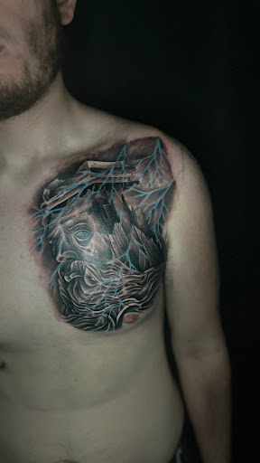 Explore mens leg tattoo ideas, creative tattoo ideas in Cadillac, available at Limitless Ink Tattoo Studio