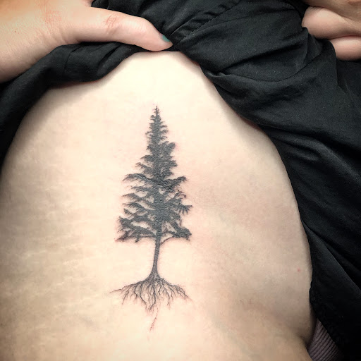 Explore broken glass tattoo ideas, creative tattoo ideas in Scarsdale, available at Damm Nice Tattoo & Body Art