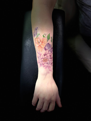 Explore october birth flower tattoo ideas, creative tattoo ideas in Fayetteville, available at Stigma Ink Tattoo & Piercing Studio
