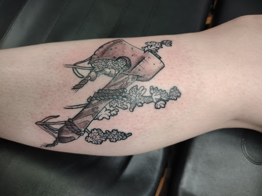 Explore christmas tree tattoo ideas, creative tattoo ideas in Williamston, available at Inkd Tattoo Parlor