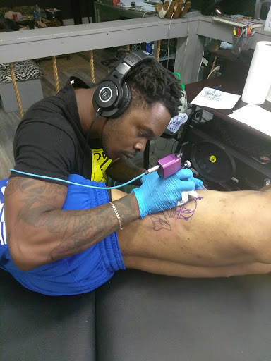 Explore cover up tattoo ideas female leg, creative tattoo ideas in Atlanta, available at Iron Palm Tattoos & Body Piercing Atlanta