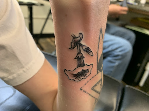 Explore dainty hand tattoo ideas, creative tattoo ideas in Alamosa, available at The Shop Tattoo & Comics