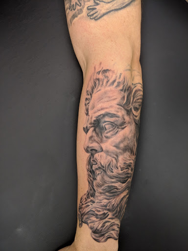 Explore fish hook tattoo ideas, creative tattoo ideas in North Arlington, available at Art In Motion Tattoo Studio