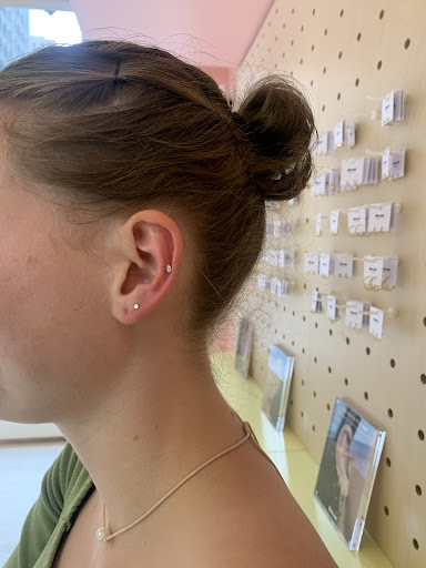 Explore cross tattoo ideas for women, creative tattoo ideas in Chicago, available at Rowan Michigan Avenue - Tribune Tower