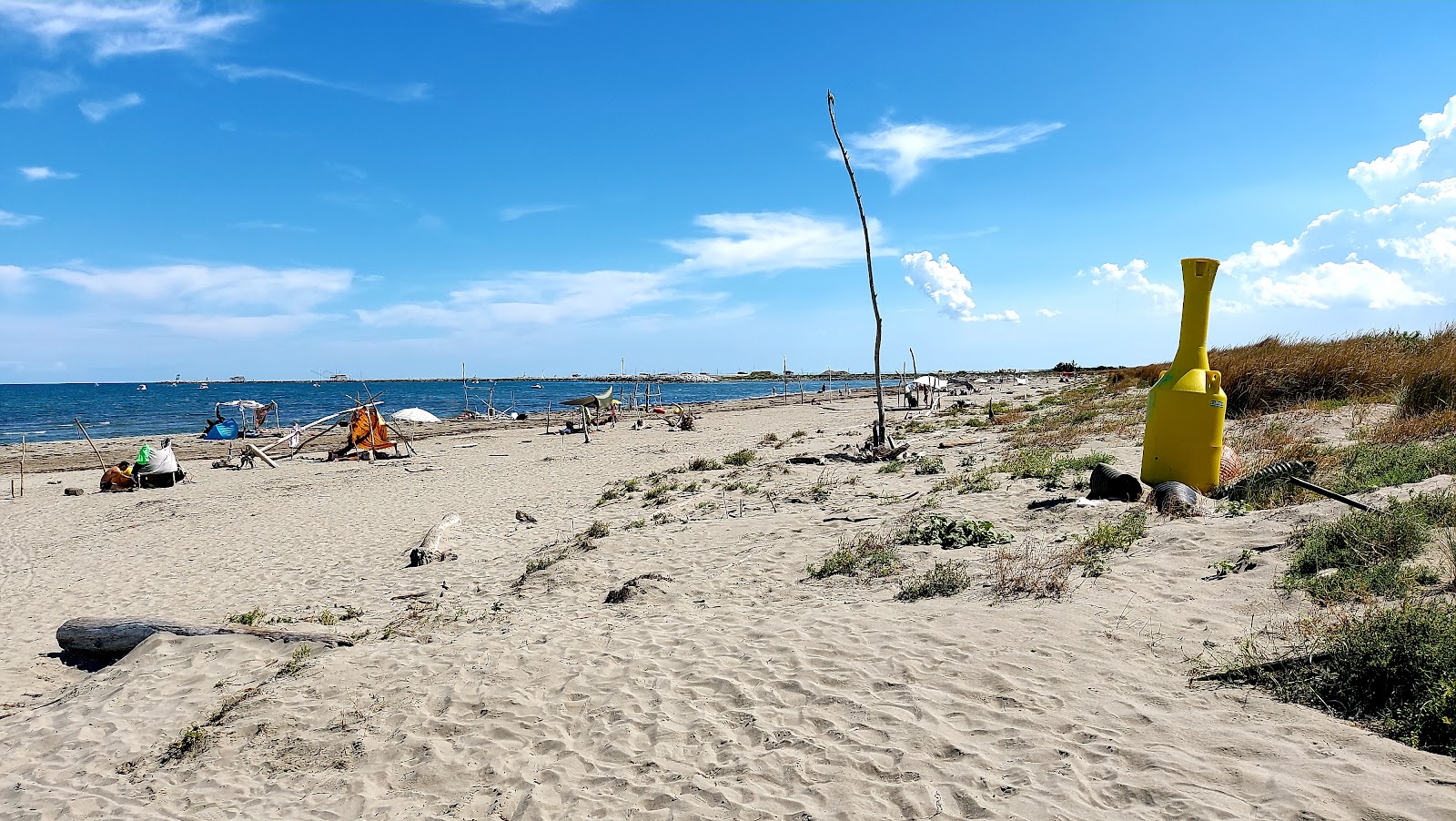 Fotografija Spiaggia di Ca Roman z dolga ravna obala