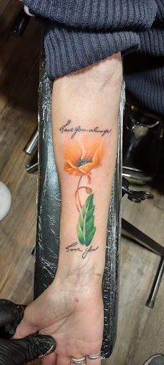 Explore fantasy book tattoo ideas, creative tattoo ideas in Oelwein, available at Purple Thistle Tattoo