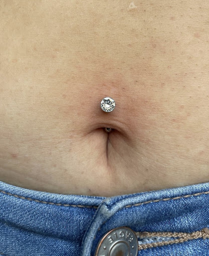 Explore rose tattoo cover up ideas, creative tattoo ideas in Ypsilanti, available at Michigan Avenue Tattoo & Piercing