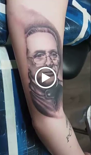 Explore rip cross tattoo ideas, creative tattoo ideas in Springfield, available at Red Tip Tattoos