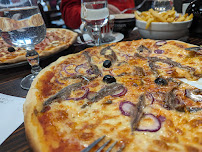 Pizza du Restaurant français Restaurant Brasserie Bar La Crémaillère à Saint-Laurent-sur-Mer - n°15