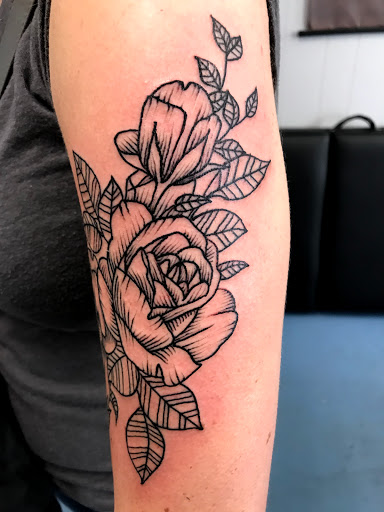 Explore hunting tattoo sleeve ideas, creative tattoo ideas in Muncie, available at The Tattoo Studio