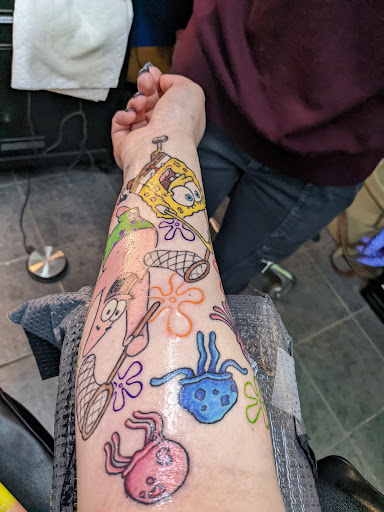 Explore calf tattoo ideas for women, creative tattoo ideas in Omaha, available at Villains Inc