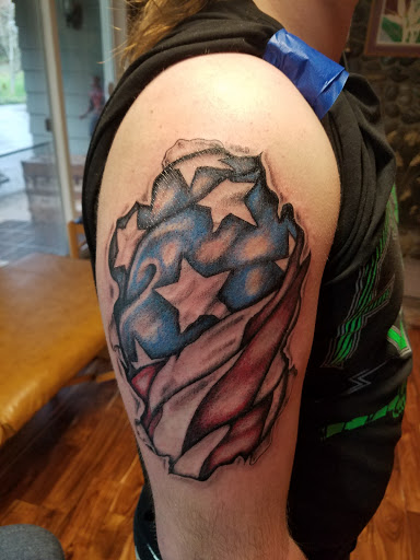 Explore men bicep tattoo ideas, creative tattoo ideas in Salem, available at Body Graphix Tattoo Studio