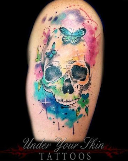 Explore rip cross tattoo ideas, creative tattoo ideas in Green Cove Springs, available at Under Your Skin Tattoos