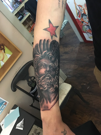 Explore back of neck tattoo ideas, creative tattoo ideas in Kingsford, available at Deft Tattoo Studio
