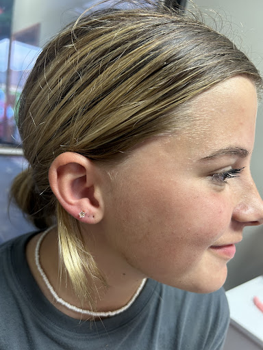 Explore cover up tattoo ideas on hip, creative tattoo ideas in Wichita, available at Primrose Piercing Co.