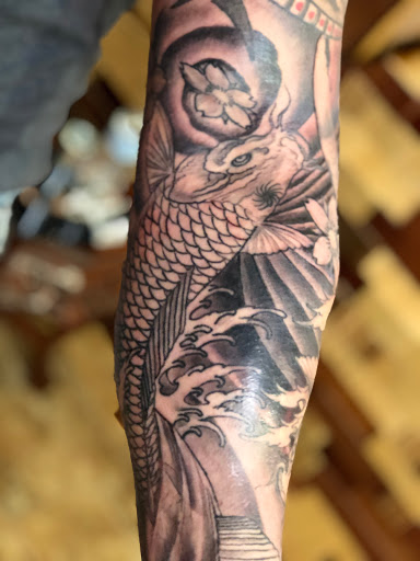 Explore cover up ideas for ankle tattoos, creative tattoo ideas in Marietta, available at Lucky Draw Tattoos III