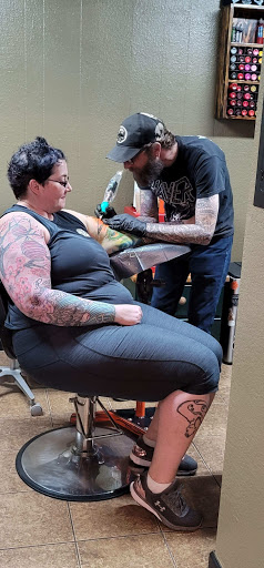 Explore red hand tattoo ideas, creative tattoo ideas in Copperas Cove, available at Black Moon Tattoo Company