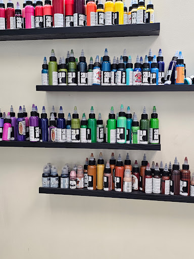 Explore christmas tree tattoo ideas, creative tattoo ideas in Charleston, available at Nemesis Tattoo and Art Gallery