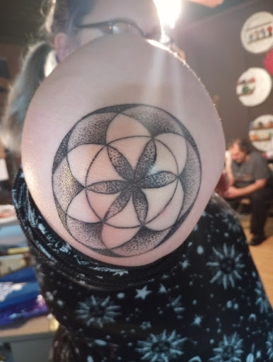Explore dominican flag tattoo ideas, creative tattoo ideas in Peckville, available at The Chaotic Cauldron Tattoos and More