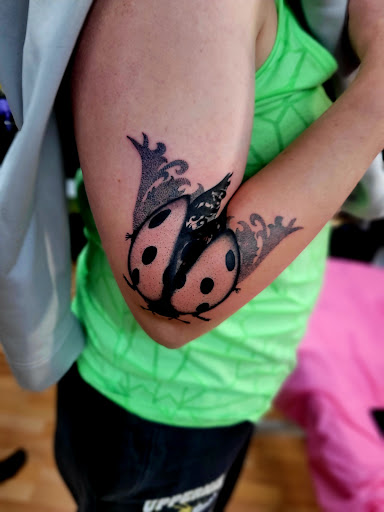 Explore stitch tattoo ideas for ladies, creative tattoo ideas in Benton, available at Spectrum Tattoo