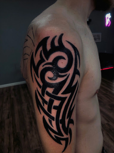 Explore wolf tattoo ideas for men, creative tattoo ideas in North Tonawanda, available at Dark Side Ink Tattoo Studio