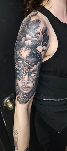 Explore last name back tattoo ideas, creative tattoo ideas in Largo, available at Alchemy Tattoos and Body Piercings