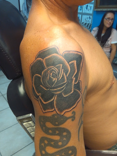 Explore flower tattoo cover up ideas, creative tattoo ideas in Bradenton, available at Memory Lane Tattoo Co.