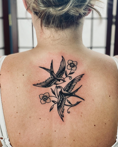 Explore skull and crossbones tattoo ideas, creative tattoo ideas in Ironwood, available at Iron Ink Tattoos