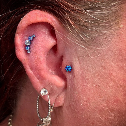 Explore maple leaf tattoo ideas, creative tattoo ideas in Bay Shore, available at Piercings By Dean 95