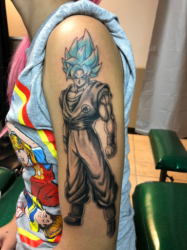 Explore surfboard tattoo ideas, creative tattoo ideas in Alamogordo, available at The Poison Frog Tattoo Studio