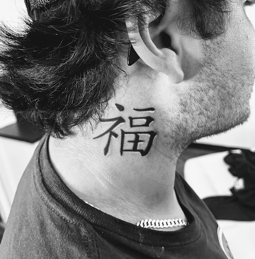 Explore mens rose tattoo ideas, creative tattoo ideas in Rogers, available at Ink Solutions Tattoo