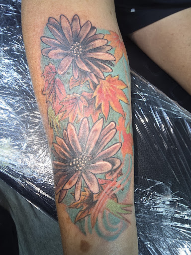 Explore hidden tattoo ideas, creative tattoo ideas in Angola, available at Hoodlum Ink