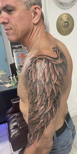 Explore colored tattoo ideas for men, creative tattoo ideas in Daytona Beach, available at Studio 21 Tattoo & Piercings Daytona Beach