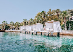Kalem Island Oliviera Plaji'in fotoğrafı geniş bir kıyı şeridi ile birlikte