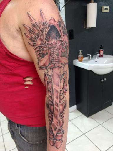 Explore grinch tattoo ideas, creative tattoo ideas in Milan, available at Apocalyptic Ink Studio