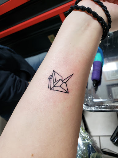 Explore daddy daughter tattoo ideas, creative tattoo ideas in Franklin Park, available at Atmosphere Tattoo Gallery - Franklin Park