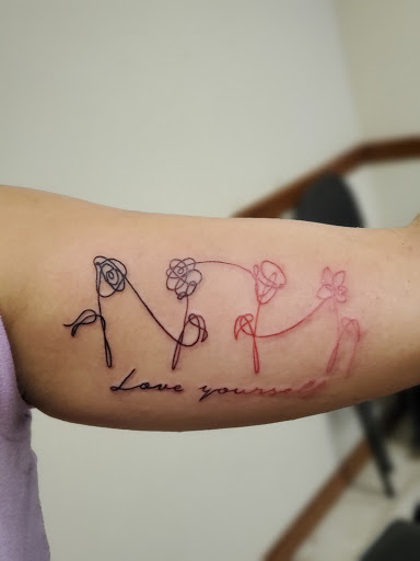 Explore lone wolf tattoo ideas, creative tattoo ideas in Stamford, available at KE Tattoo Studio