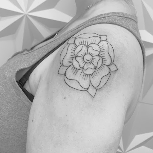 Explore skier tattoo ideas, creative tattoo ideas in Fairfax, available at Pinky Inky Tattoo