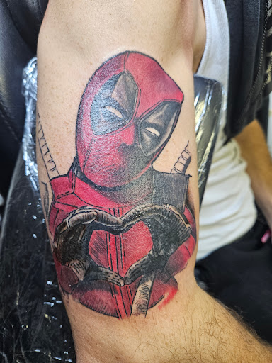 Explore women's tattoo placement ideas, creative tattoo ideas in Angola, available at Hoodlum Ink