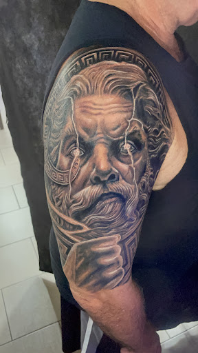 Explore cool hand tattoo ideas for guys, creative tattoo ideas in Sarasota, available at SEVEN SINS Tattoo Studio